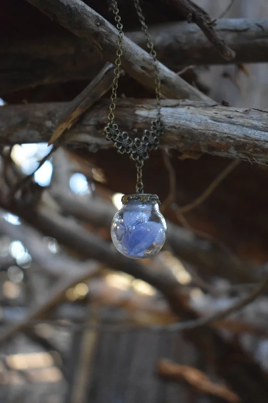 trendy pendant necklaces for women-Dried Blue Flower Terrarium Globe Necklace